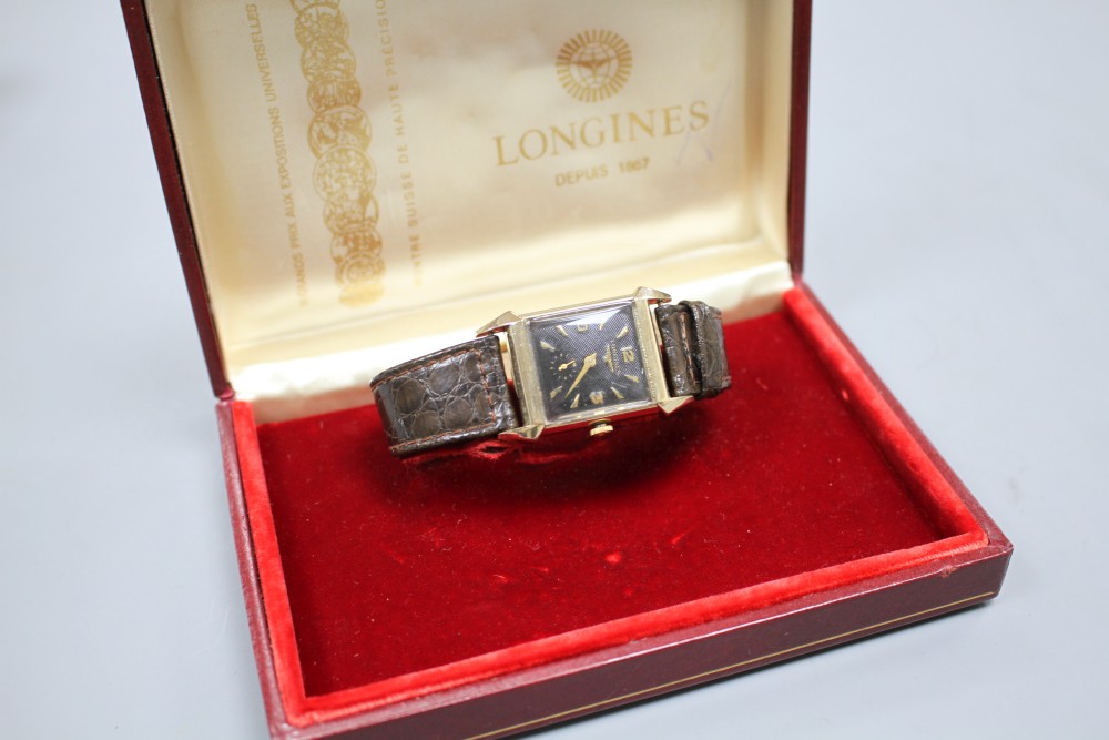 A gentlemans 1940s 10k gold filled Longines manual wind wrist watch, with rectangular Arabic and baton dial